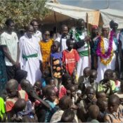 The Bishop with the Clergy take a photo with the Dadaab refugee community